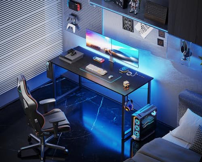 KKL Small Desk with Power Outlets and USB Port Computer Desk for Home Office Gaming Simple Modern Style Writing Desks with Storage Bag Headphone Hook, 48 inch, Black