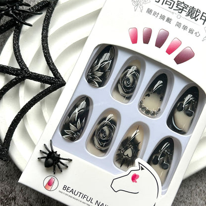 KKUUOO Stiletto Press-on Nails - Goth Fake Nails with Skull & Black Rose Design, Rhinestone Full Cover Acrylic Nails, 24pcs for Women, Girls & Halloween Manicure