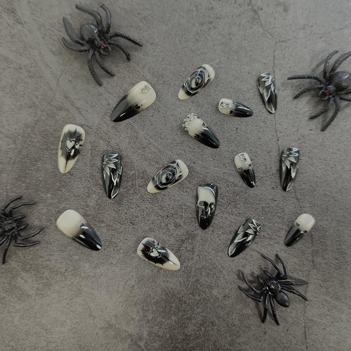 KKUUOO Stiletto Press-on Nails - Goth Fake Nails with Skull & Black Rose Design, Rhinestone Full Cover Acrylic Nails, 24pcs for Women, Girls & Halloween Manicure