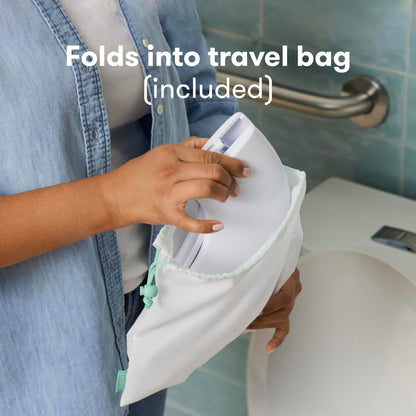 Frida Baby Fold-and-Go Portable Potty Seat for Toilet, Foldable Travel Potty Seat for Toddler, Fits Round & Oval Toilets, Non-Slip Base, Handles, Includes Free Travel Bag